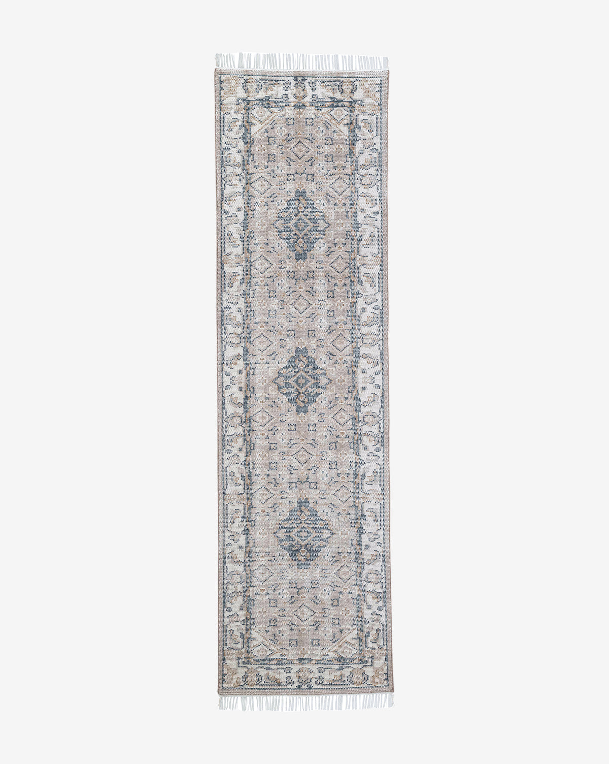 The Merilyn Hand-Knotted Rug is a long, narrow handmade piece with symmetrical, intricate patterns in muted blue and beige tones, complete with a decorative border and fringed edges, by Vendixs