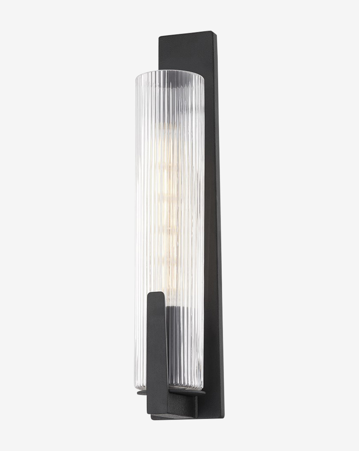 The Malakai Sconce by Troy Lighting showcases a vertical ribbed glass shade and a black rectangular backplate, providing diffused light with a visible bulb for a modern look. Vendixs