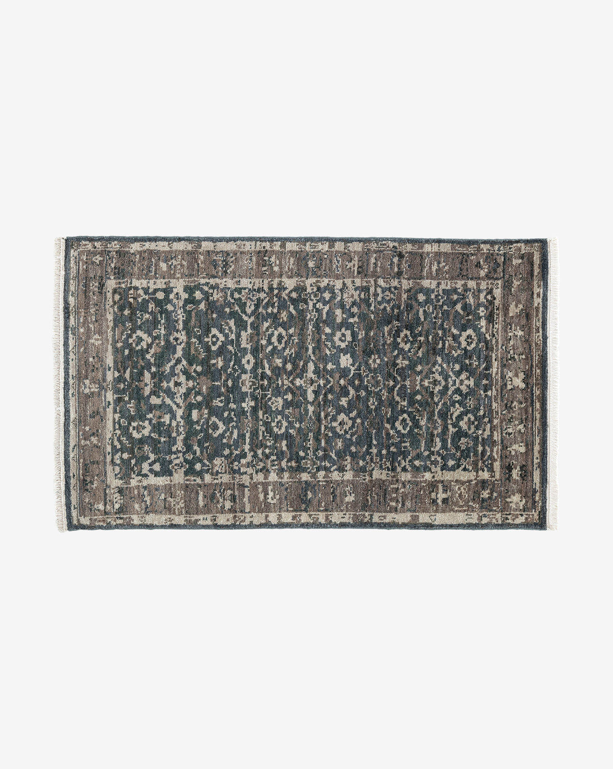 The Marta Hand-Knotted Wool Rug features a rectangular shape, distressed vintage-style pattern in blue, gray, and brown tones with intricate floral and geometric designs plus a decorative border, by Vendixs