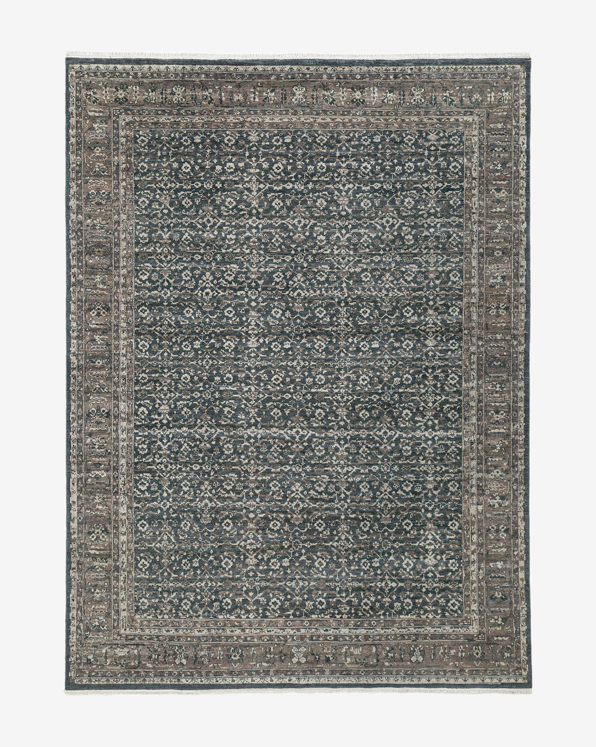 The Marta Hand-Knotted Wool Rug is a rectangular wool rug featuring an intricate, symmetrical pattern in muted blue, beige, and grey with a detailed border and densely patterned central field, by Vendixs