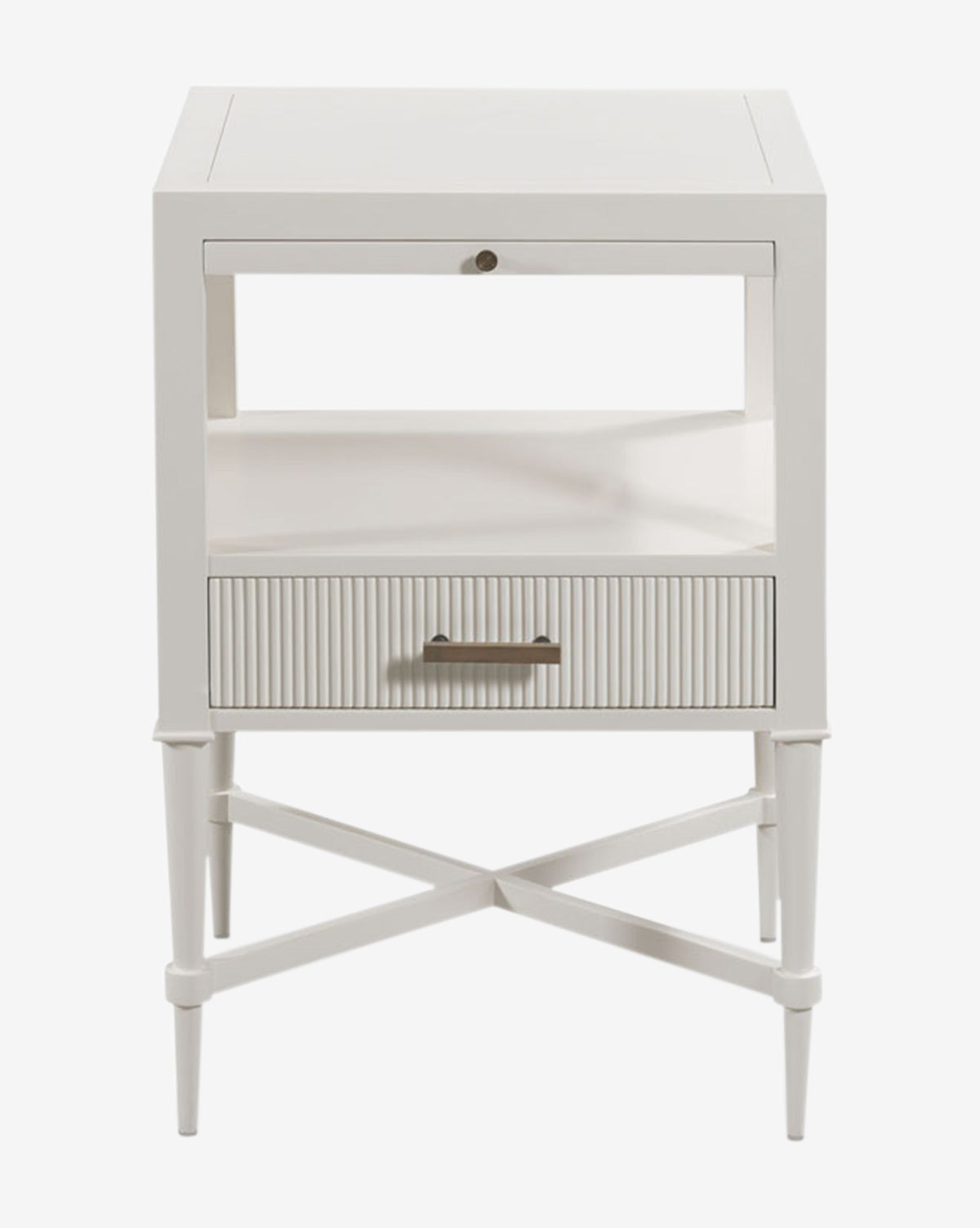 The Martinez Nightstand showcases a white wooden finish, reeded drawer front with brass hardware, an open shelf, and tapered legs with crossbars, all presented against a white background by Vendixs