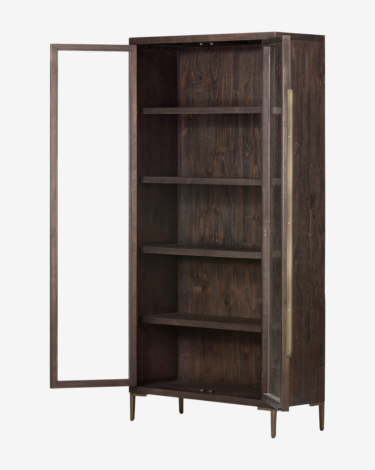 The Maverick Cabinet is a tall, dark reclaimed pine cabinet with four shelves, iron hardware, a left-hinged glass door, long brass handle, minimalist modern design, and sturdy brass legs, by Vendixs