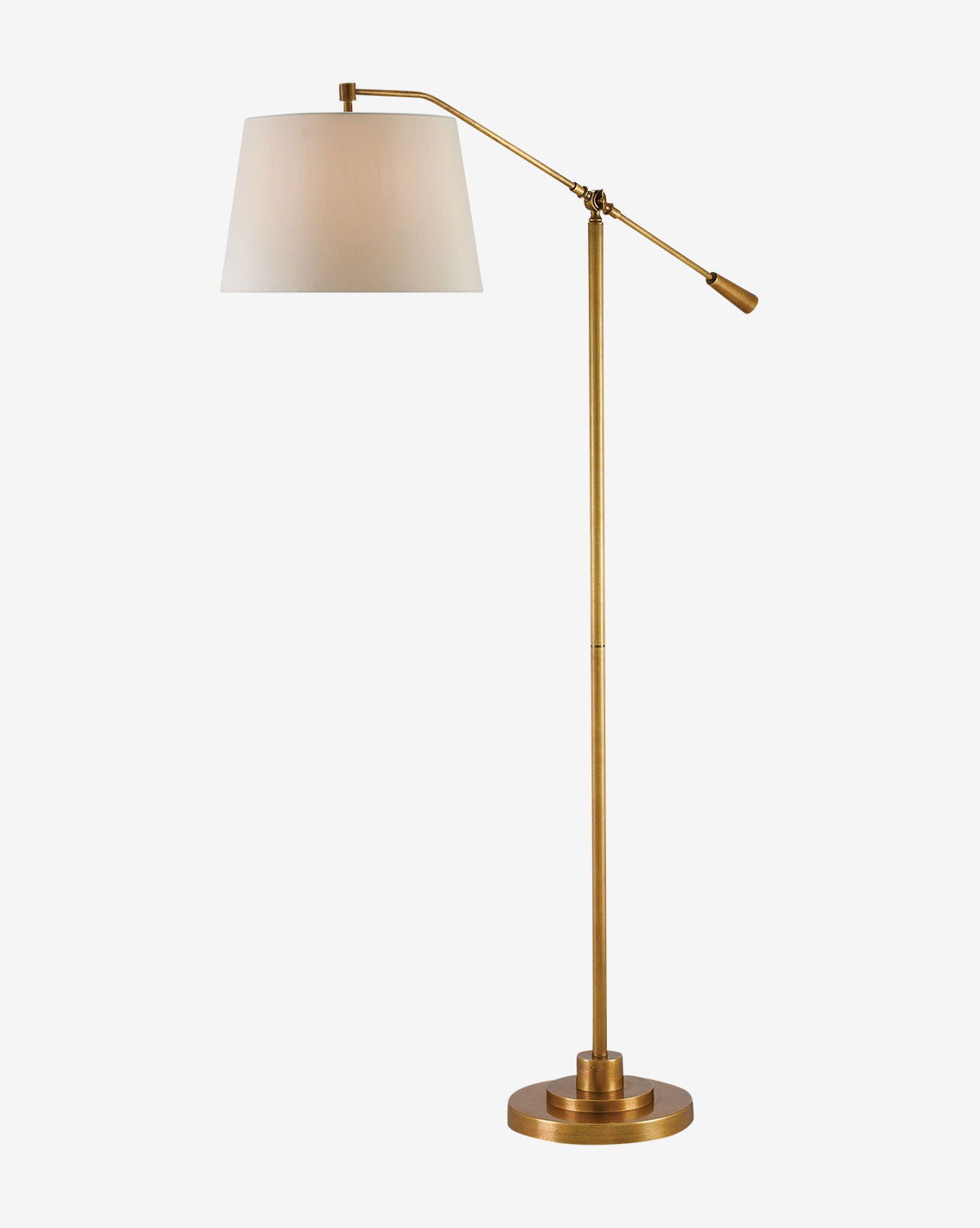 The Currey & Co. Maxstoke Floor Lamp is a tall, adjustable brass lamp with a round base and white drum shade—perfect as a stylish task light against a plain white background. Vendixs