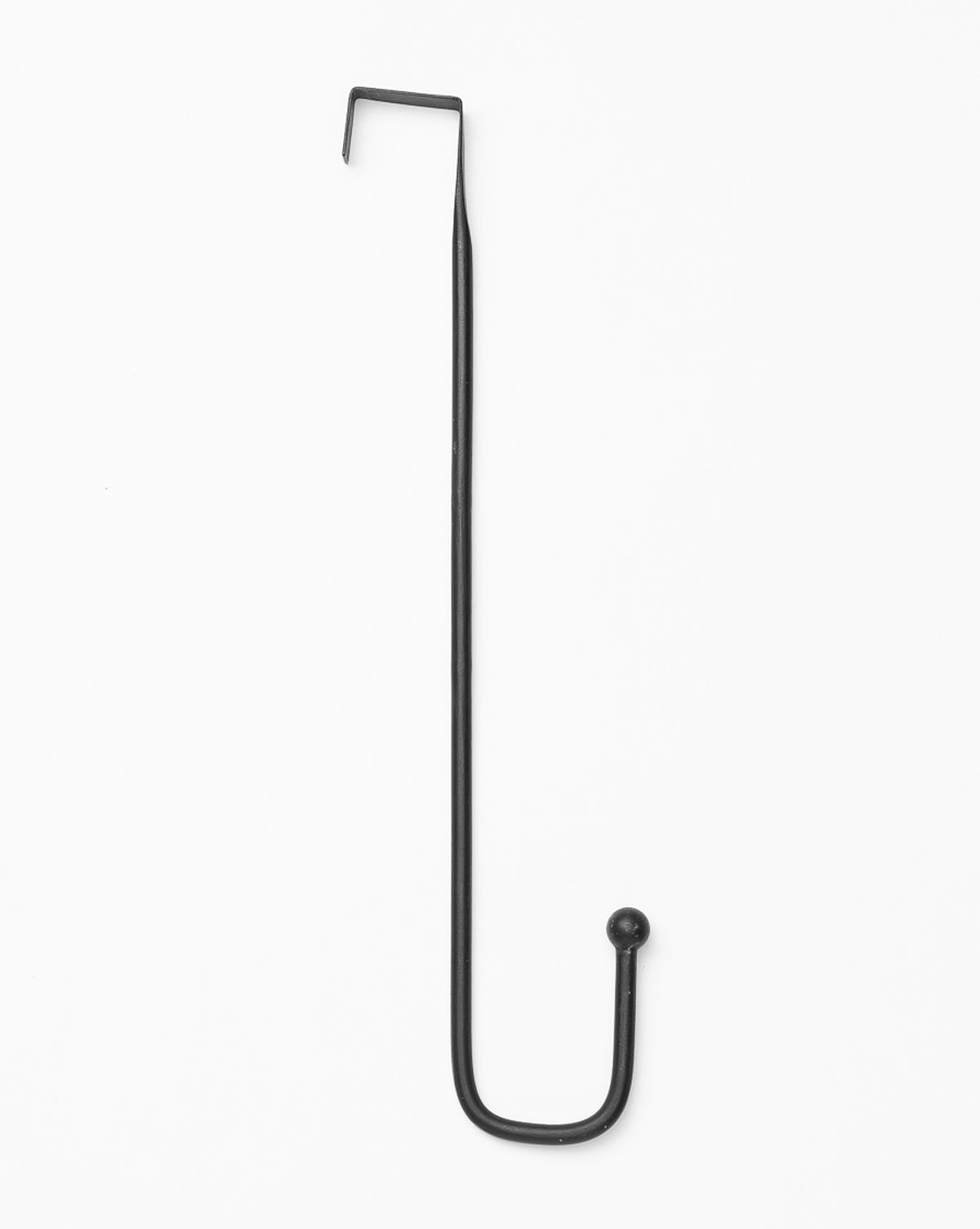 The Metal Wreath Hanger is a long, black iron hanger with a small hook at one end and a rounded tip at the other, displayed on a white background.