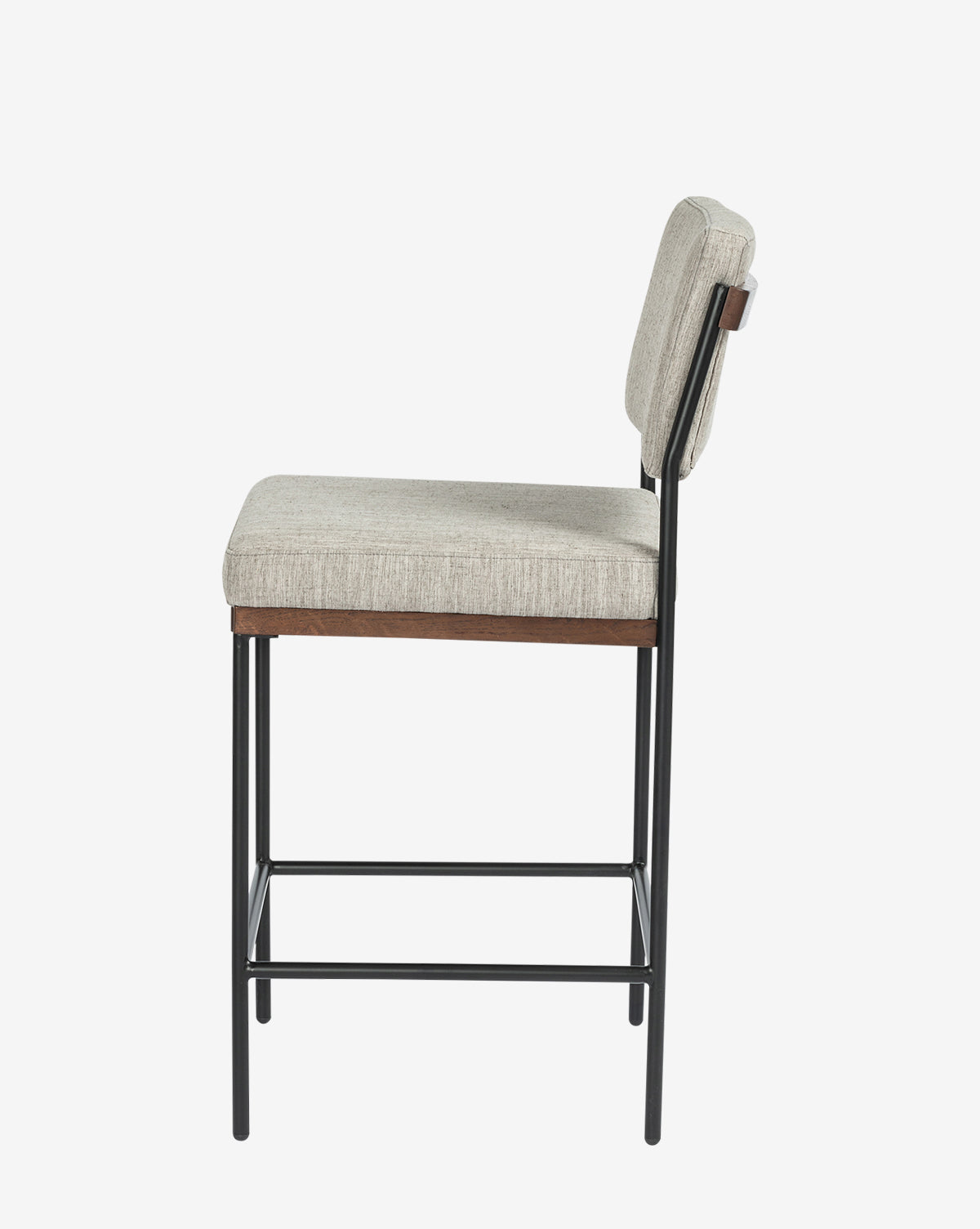 Side view of the Pascal Stool—a versatile chair with a light gray upholstered seat and backrest, supported by a sturdy black iron frame featuring four legs connected by horizontal bars for added stability, by McGee & Co.