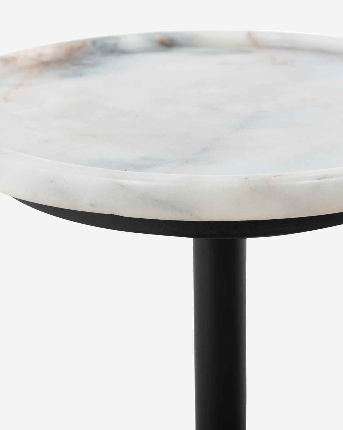A close-up of the Raelynn Side Table shows its round antique marble top with subtle gray veining and a sleek black metal leg, set against a white background, by Vendixs