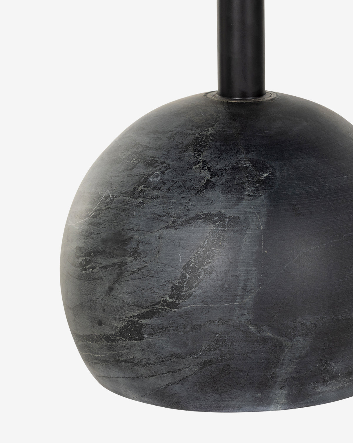 Close-up of the Raelynn Side Table’s sleek, rounded black antique marble base with soft gray veining and a vertical black metal pole, set against a plain white background, by McGee & Co.