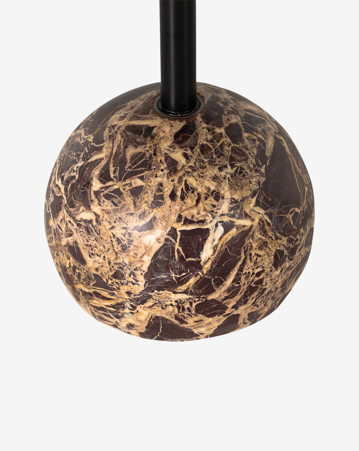 A close-up of the Raelynn Side Table’s round brown marble base with beige and gold veining, supporting a sleek black rod, shown against a plain white background, by Vendixs