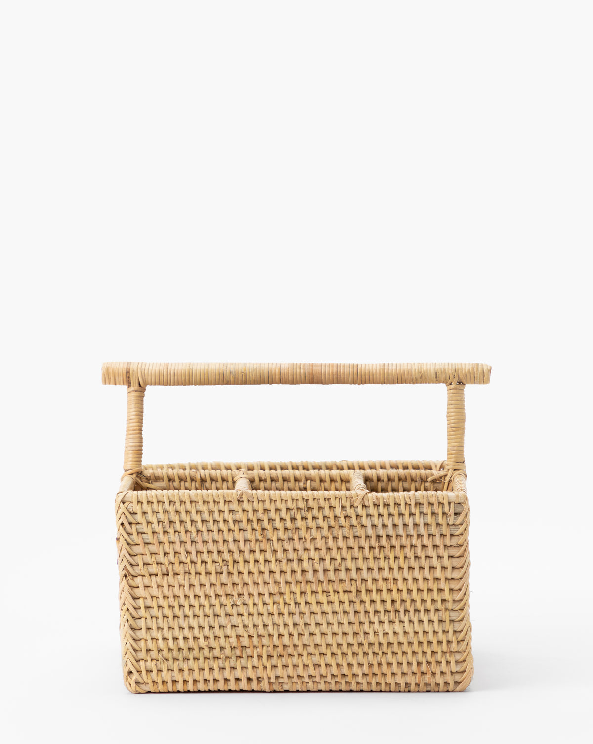 The Rattan Utensil Caddy is a rectangular woven basket in light tan with a sturdy top handle, perfect for organizing flatware, by Vendixs Its minimalist design stands out against a plain white background.