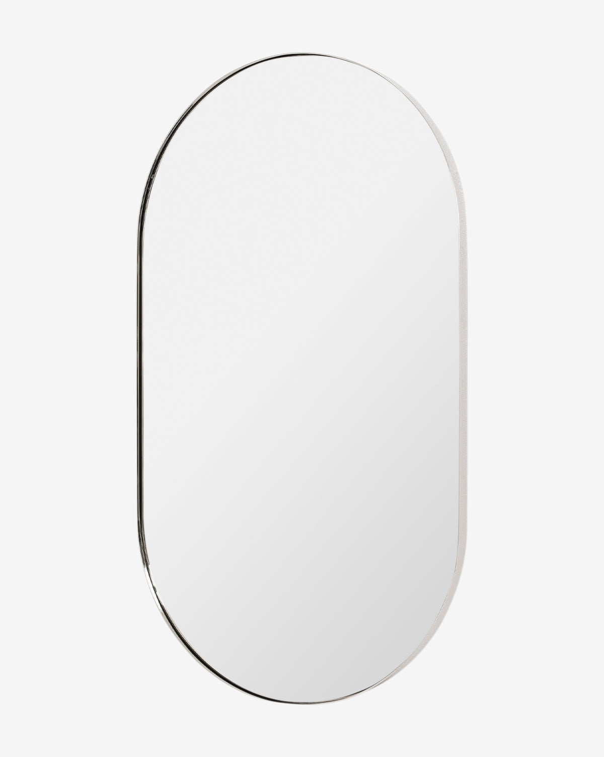The Rye Wall Mirror features an oval design with a slim stainless steel frame and is shown against a plain white background, by Vendixs