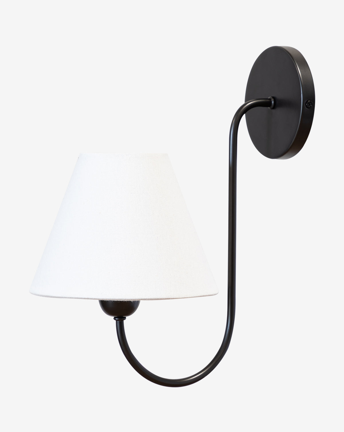The Makerspalm Wainwright Single Swoop Sconce is a black, wall-mounted light with a curved arm and a white linen shade, shown against a plain white background. Vendixs