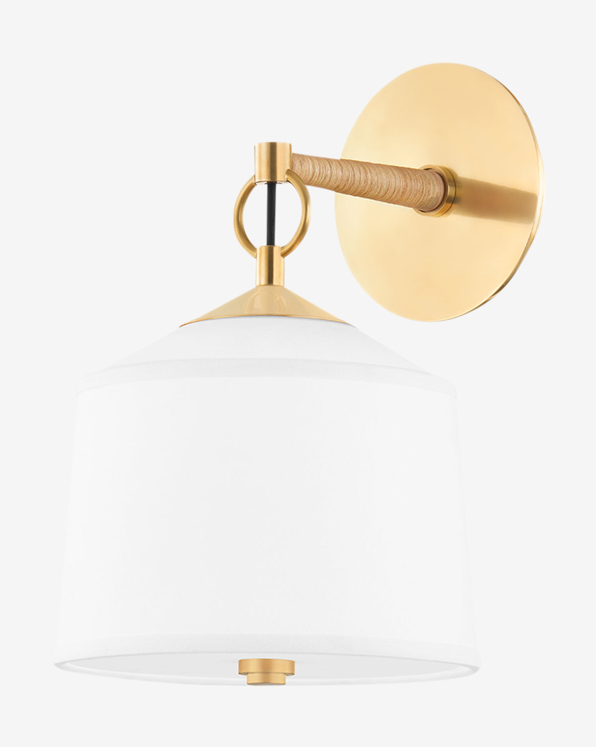The White Plains Wall Sconce by Hudson Valley Lighting features a round aged-brass backplate, short horizontal arm, white fabric shade, and accents in brass and wood with an elegant rattan-wrapped detail for added texture. Vendixs