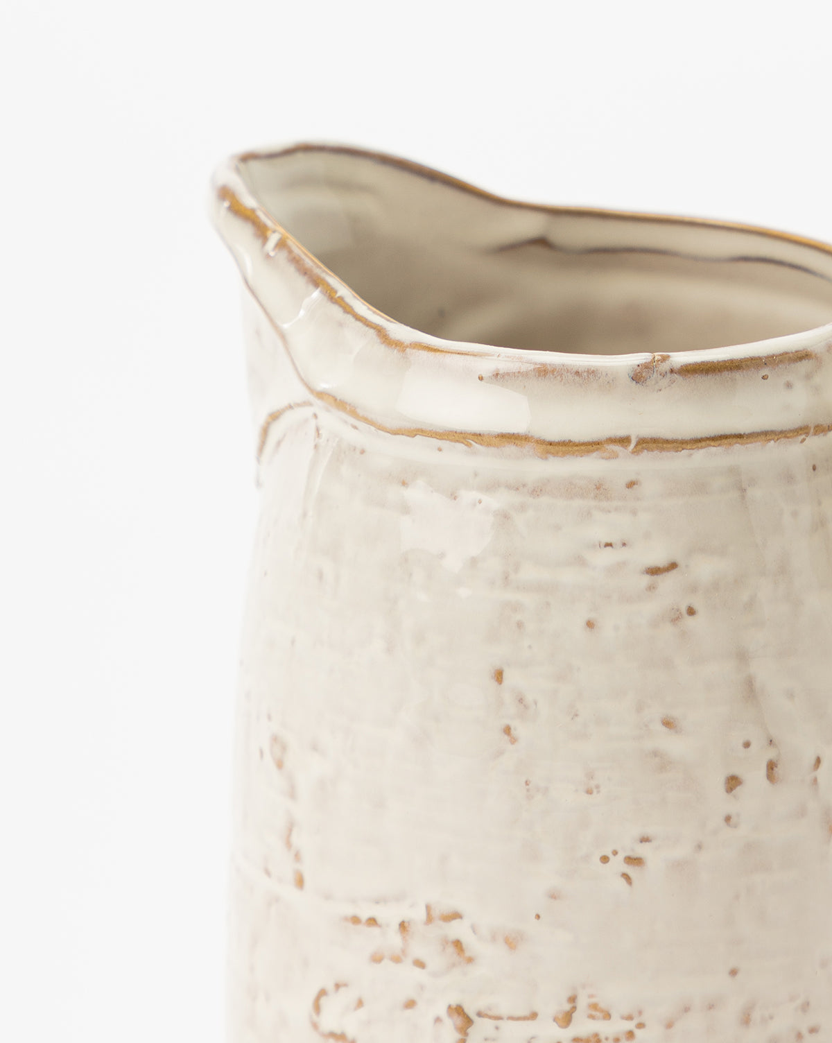 Close-up of the White Stoneware Pitcher, handmade with a cream-colored, slightly rough and uneven surface, visible texture details, and an irregular rim, shown against a white background, by Vendixs