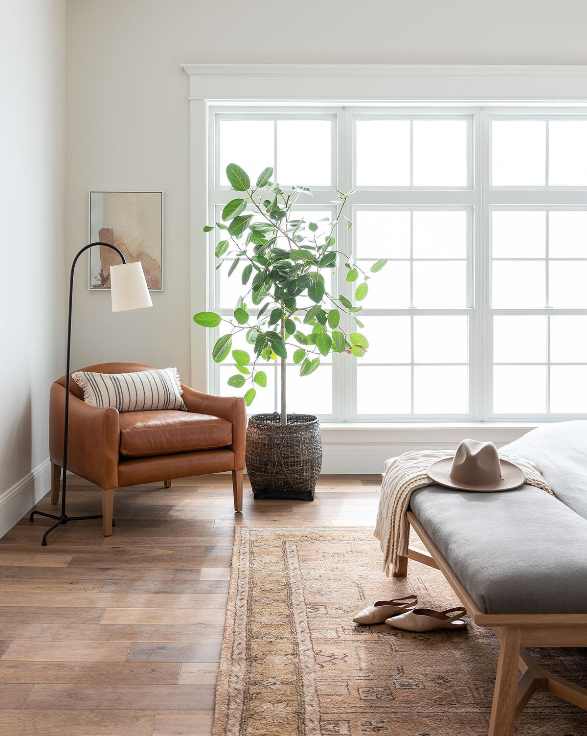 Light wood floors and the Ellington Fawn Hand-Tufted Wool Rug add warmth, by Vendixs