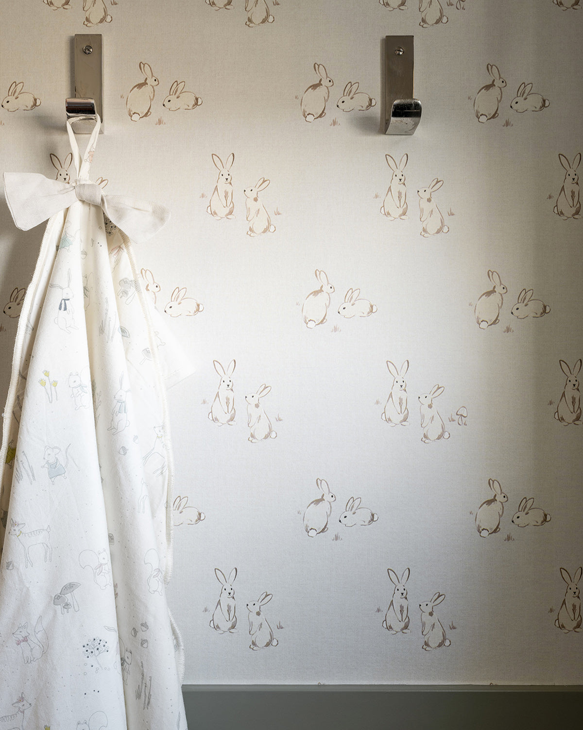 Wallpaper featuring darling bunnies in couplets with a soft gray and taupe palette for a sweet look by Vendixs
