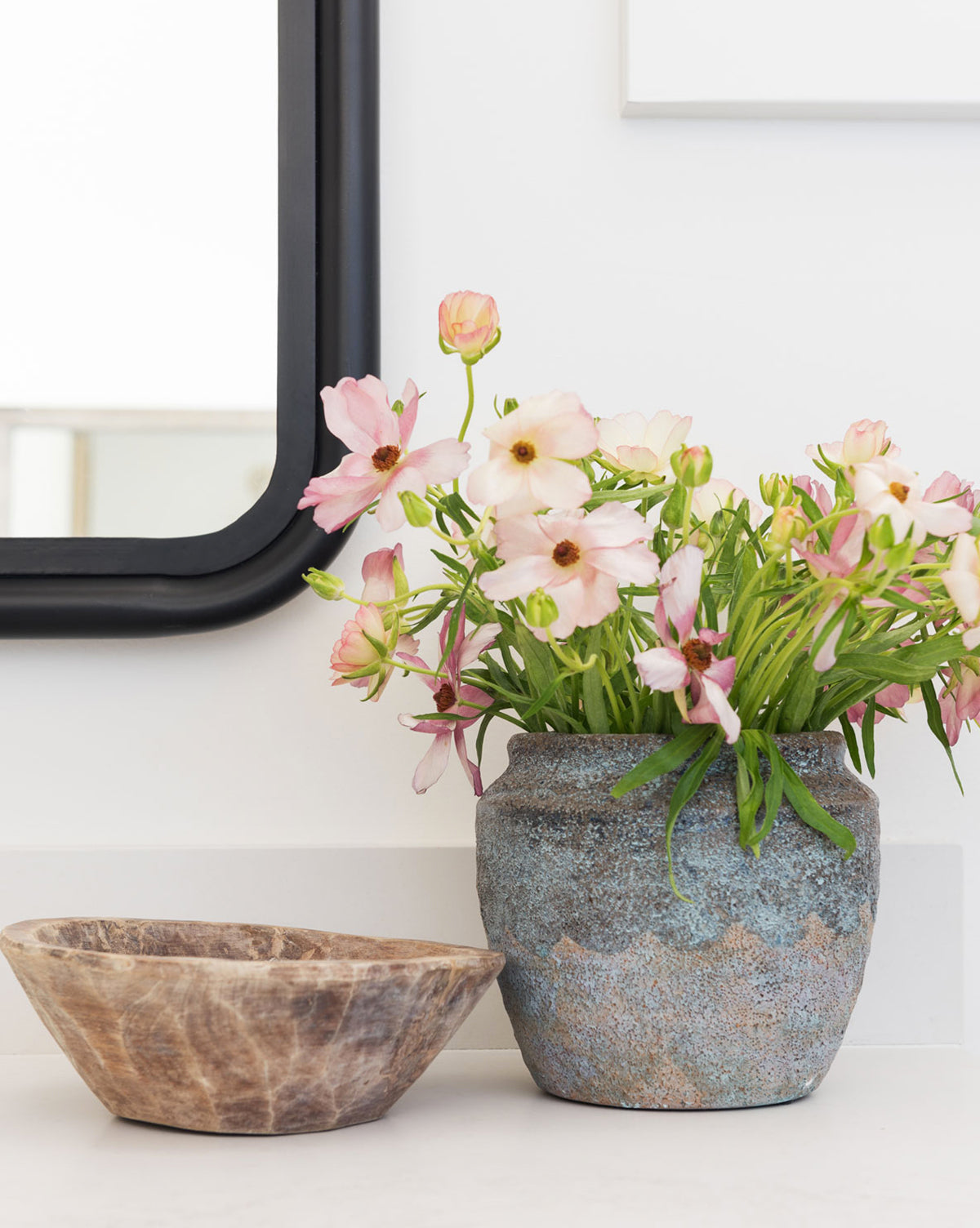 Earthy Textured Pot in profile, showing natural color variation and handcrafted detail, with flowers from Vendixs
