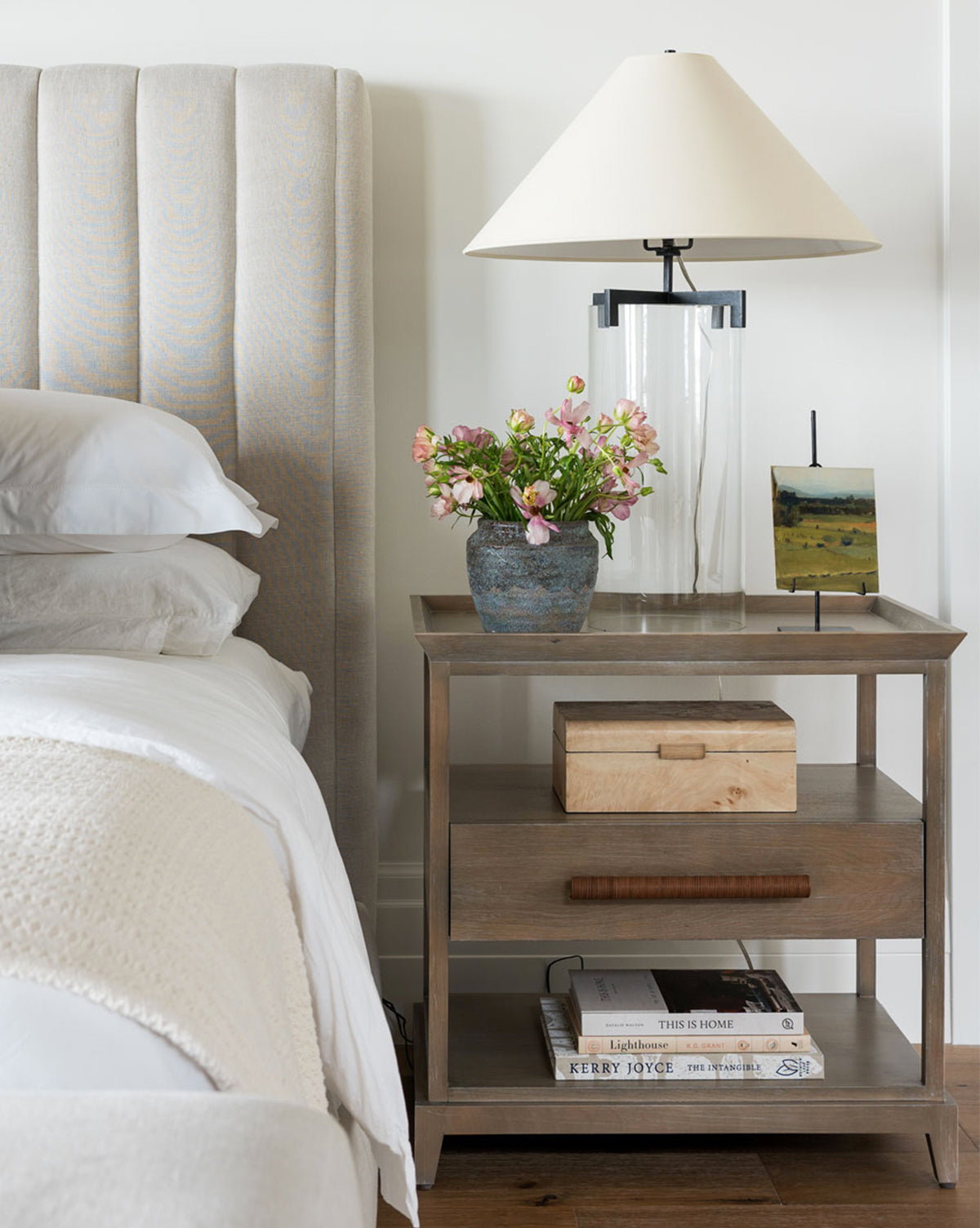 Nightstand view of earthy textured pot with flowers from Vendixs